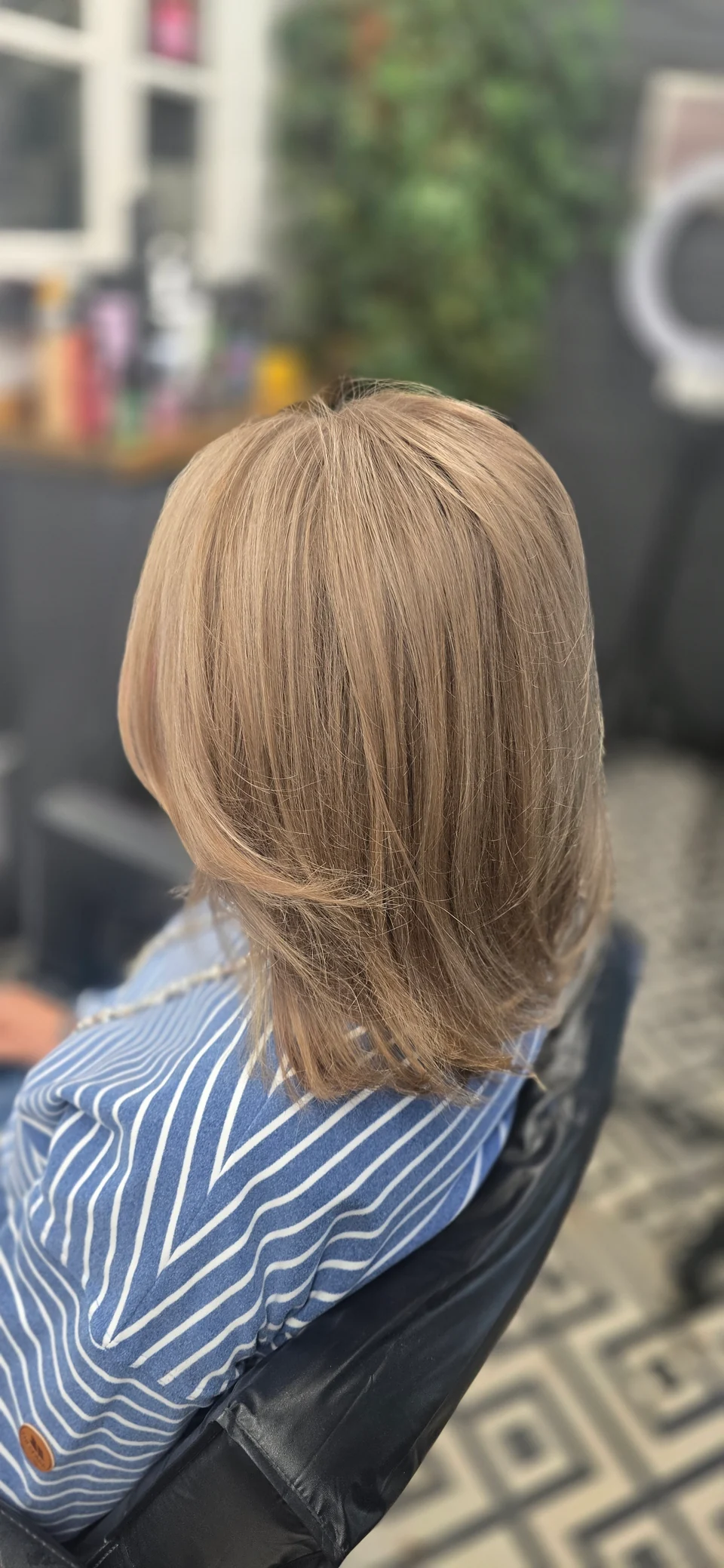 Shoulder-length blonde hair with face-framing layers