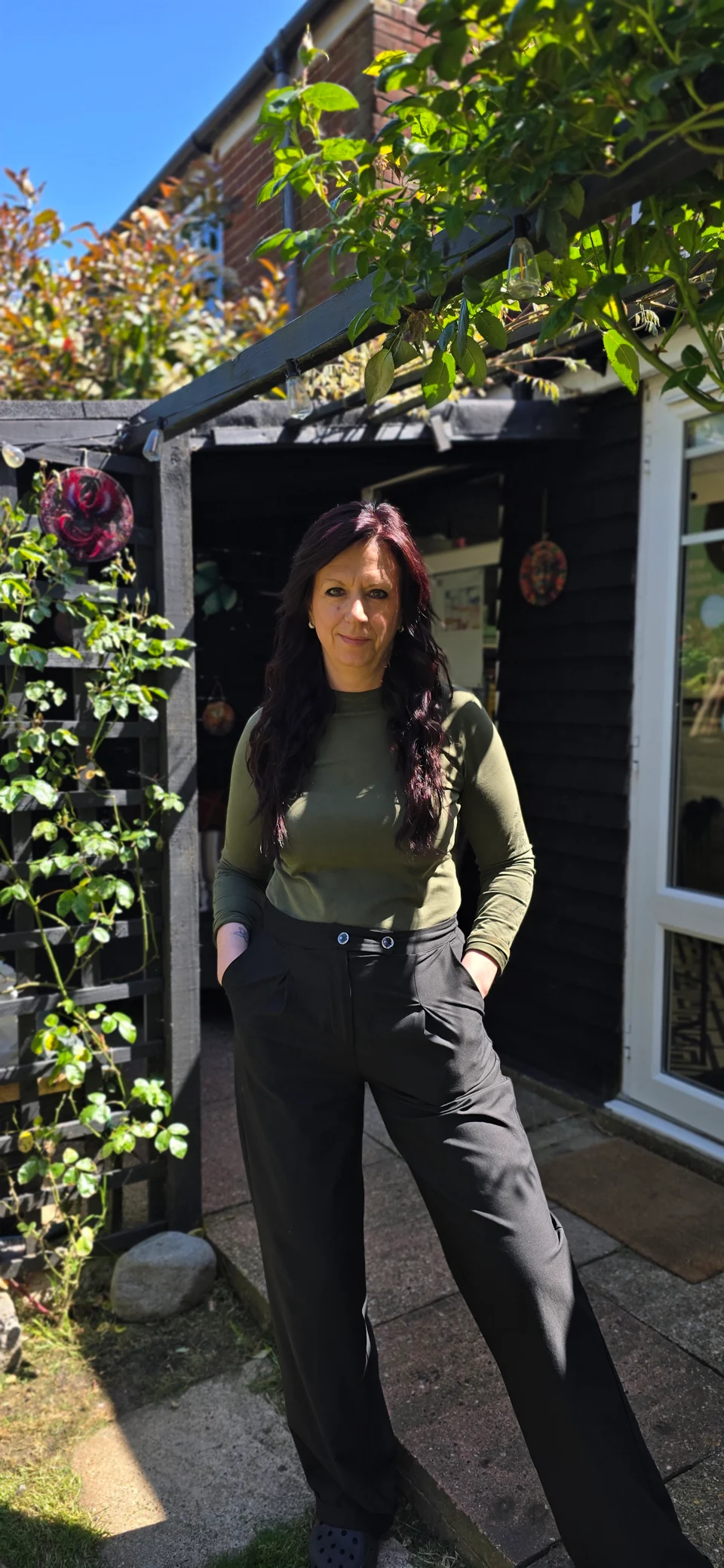 Me outside my salon beside the garden